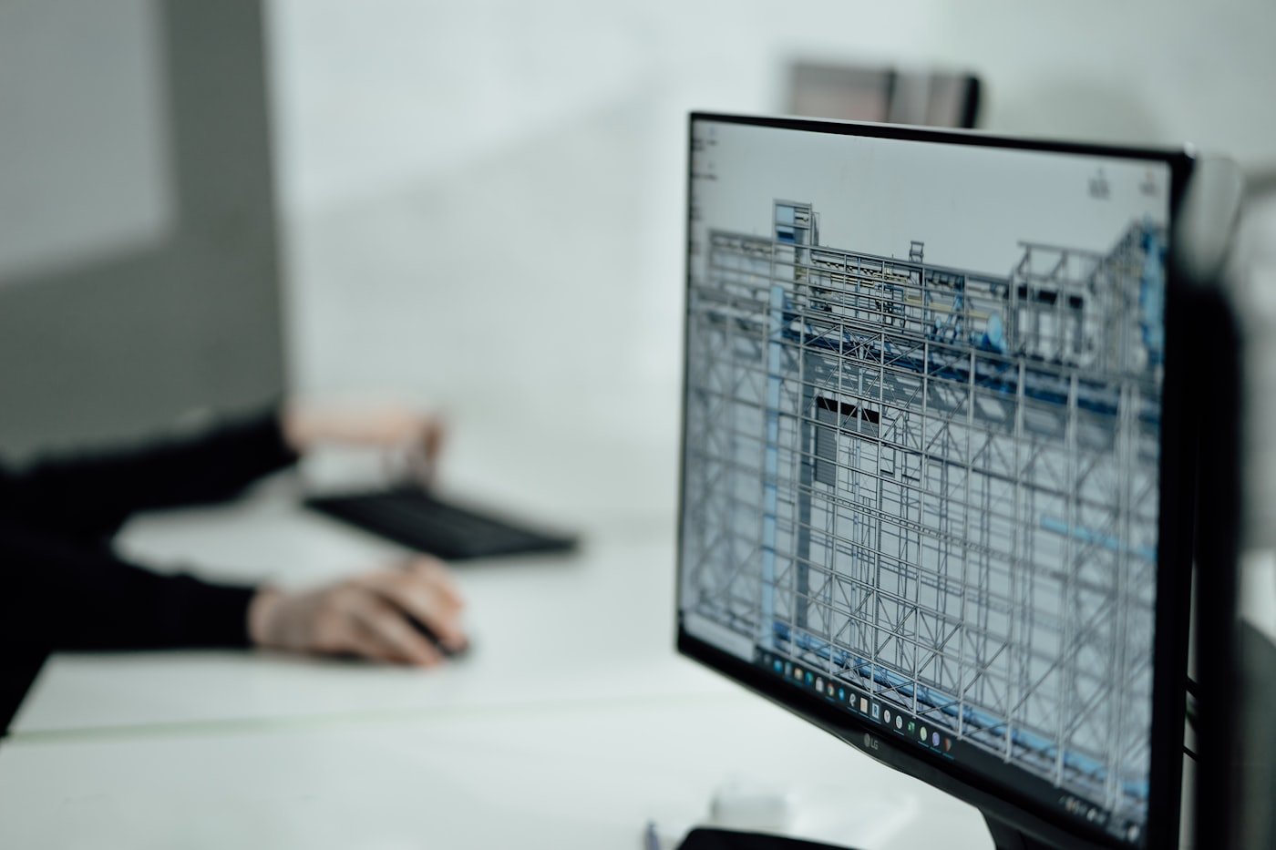 Engineer reviewing a building model at a workstation